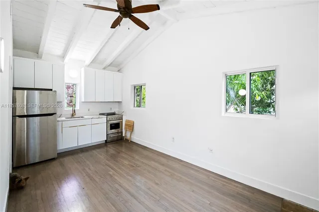 a view of room with hardwood floor and window