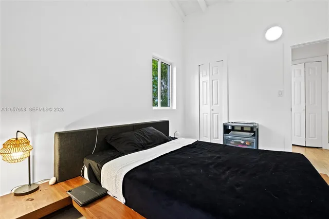 a bathroom with a shower a sink a toilet and mirror