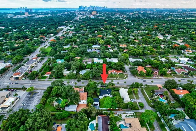 an aerial view of lake and houses with outdoor space