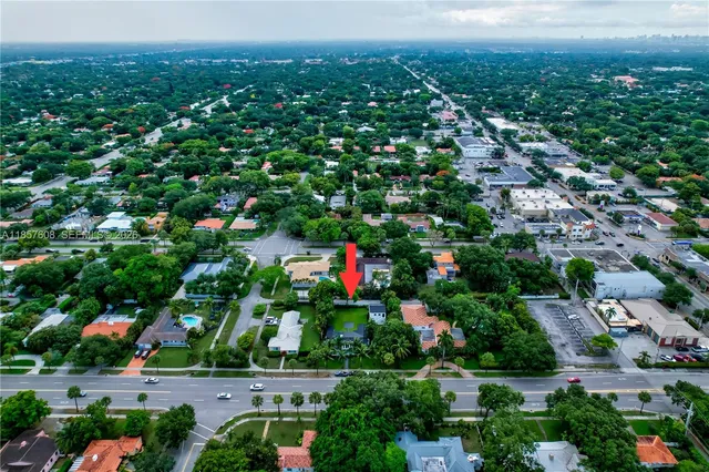 a view of a backyard with sitting area