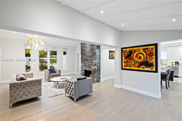 a living room with furniture and large window