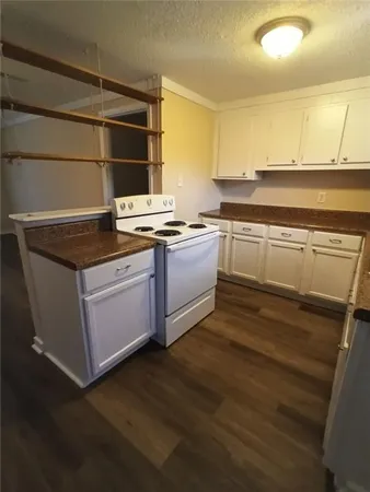 a kitchen with stainless steel appliances granite countertop a stove and a sink