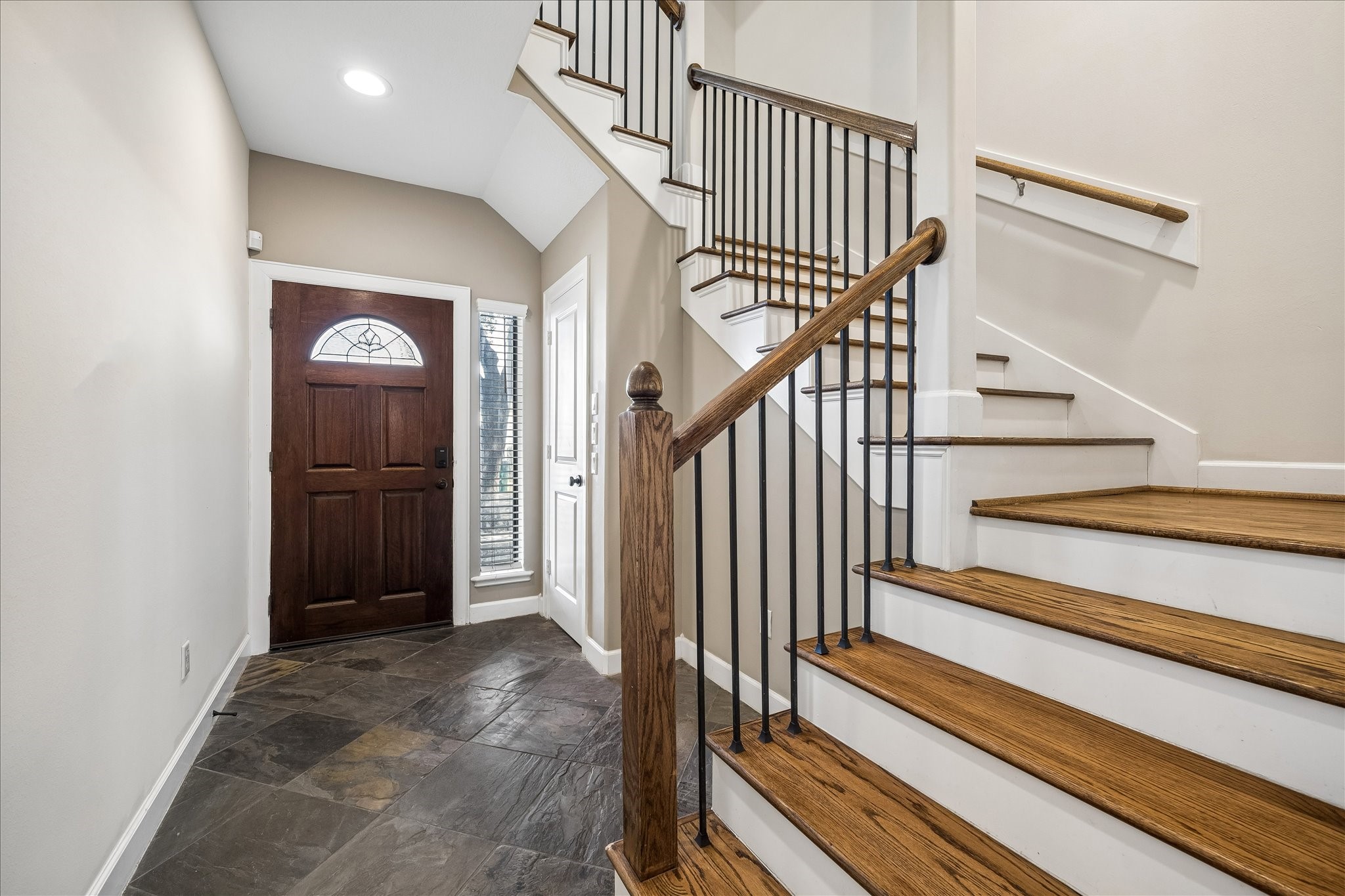 5811 Maxie Street Houston, TX 77007 - Photo 11 of 19 a view of a hallway with wooden floor and entryway