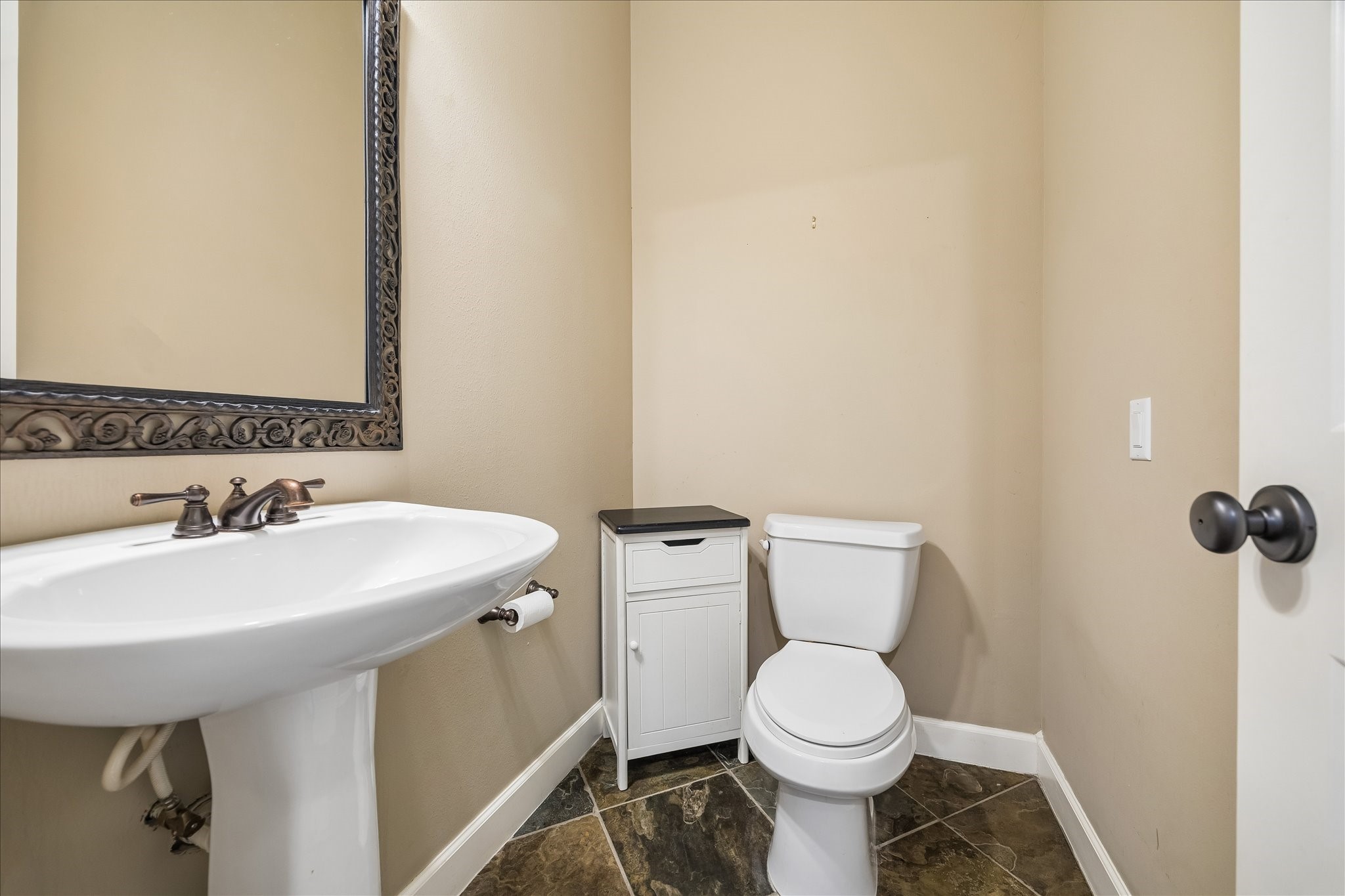 5811 Maxie Street Houston, TX 77007 - Photo 17 of 19 a bathroom with a sink and a toilet