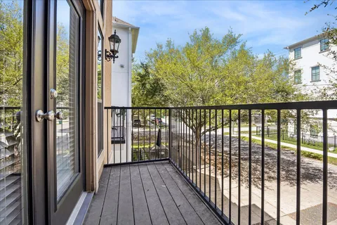 a view of a balcony with wooden floor