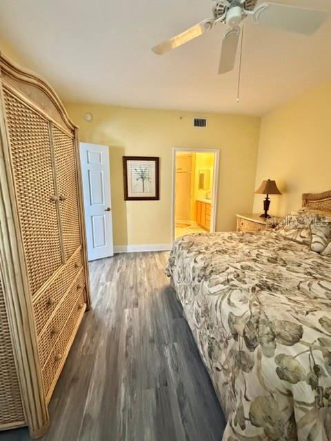 13413 Gasparilla Road, Unit 304 Placida, FL 33946 - Photo 15 of 28 a bedroom with a bed and wooden floor