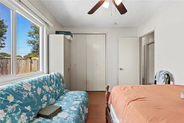 a bedroom with a bed and window