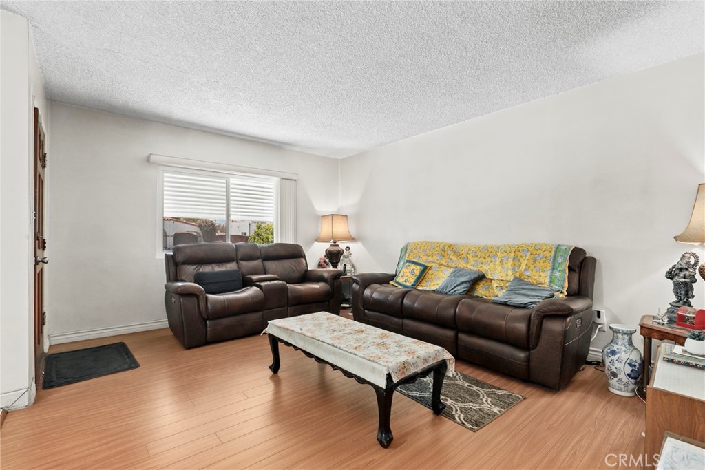 2508 El Paseo Alhambra, CA 91803 - Photo 5 of 21 a living room with furniture and a wooden floor