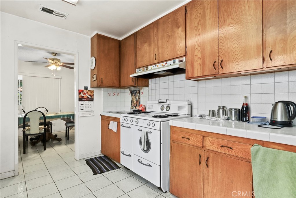2508 El Paseo Alhambra, CA 91803 - Photo 10 of 21 a kitchen with stainless steel appliances granite countertop a sink stove and cabinets