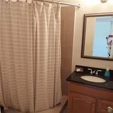 a bathroom with a sink a vanity and a mirror