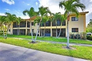 a house with palm tree in front of it