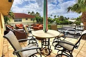 a view of a chairs and table in the patio