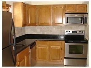 a kitchen with a sink and a microwave