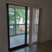 a view of a porch with a floor to ceiling window
