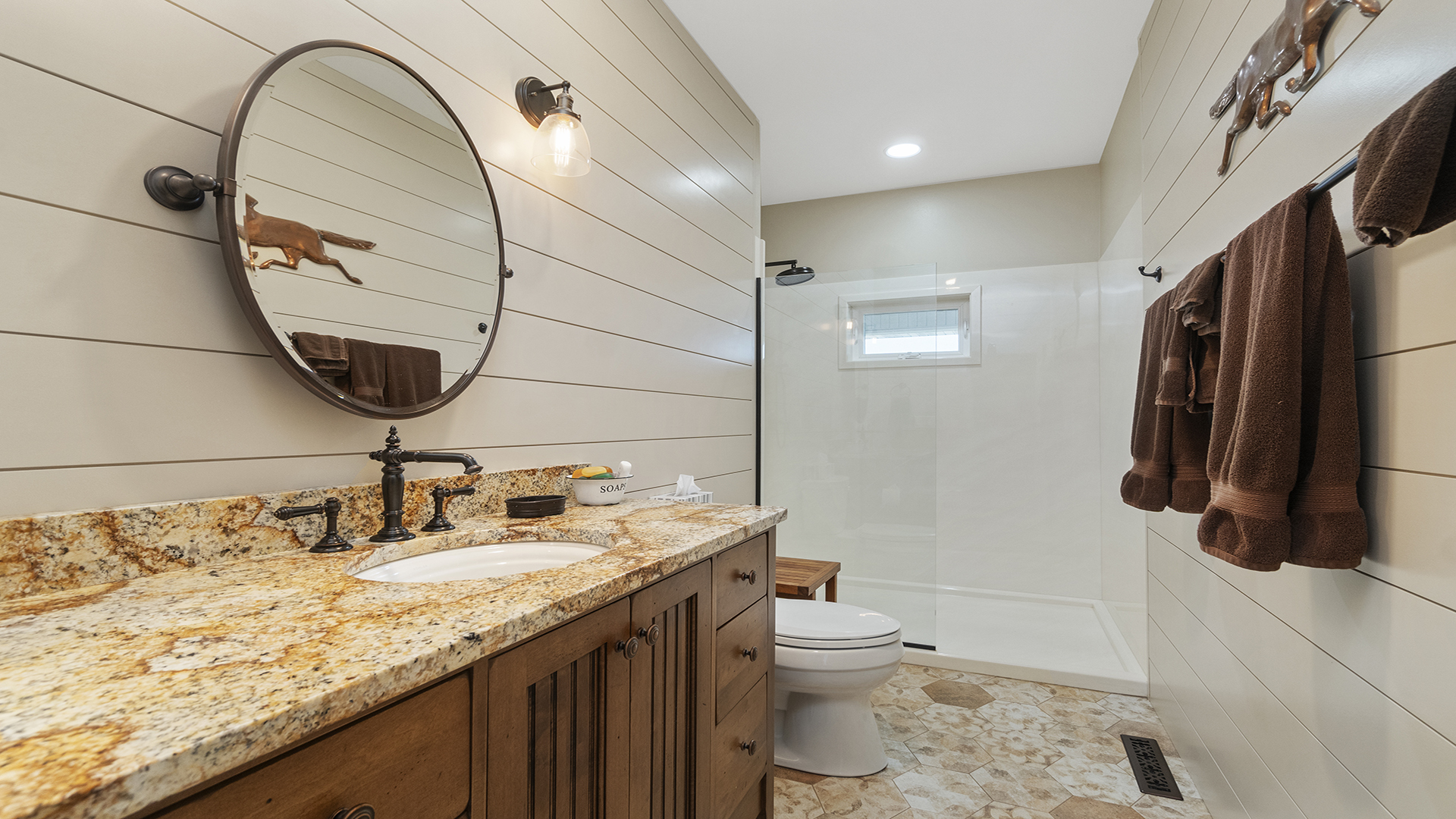 5465 West Penn Corner Road Oregon, IL 61061 - Photo 49 of 56 a bathroom with a granite countertop sink a toilet and a mirror