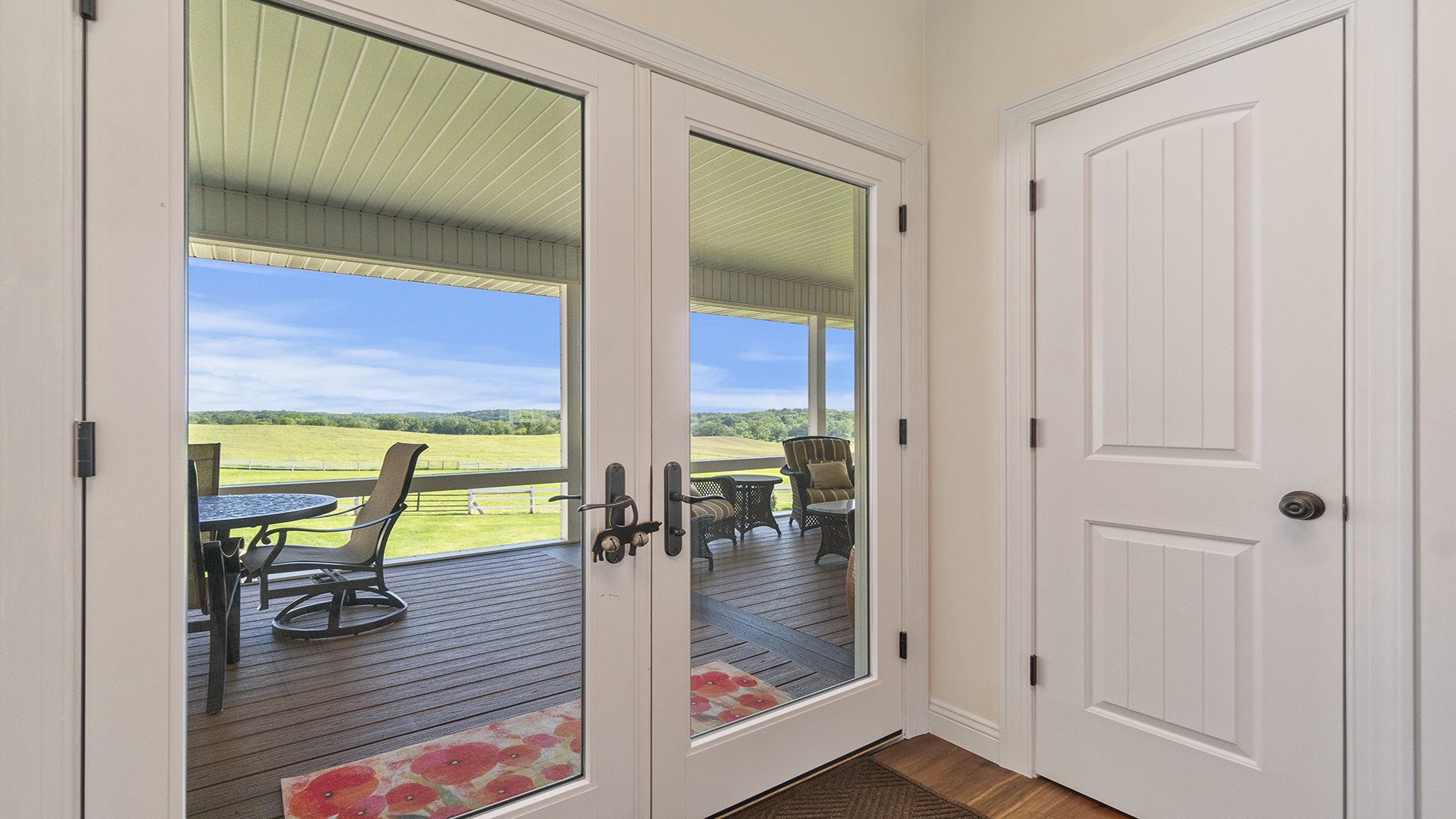 5465 West Penn Corner Road Oregon, IL 61061 - Photo 51 of 56 a view of a hallway view with wooden floor and a glass door