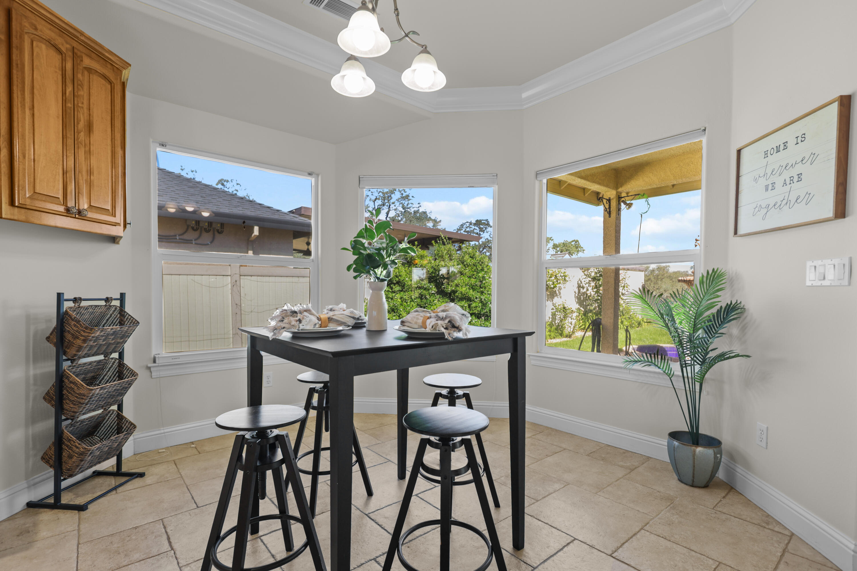2110 Cadjew Street Redding, CA 96003 - Photo 15 of 62 a view of a dining room with furniture and a potted plant