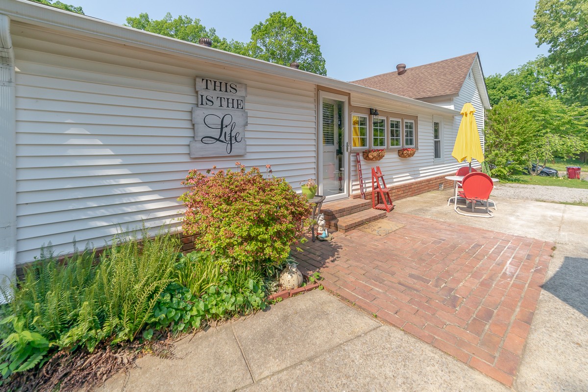 409 South 11th Street Clarksville, TN 37040 - Photo 25 of 29 a view of a backyard with sitting area and garden