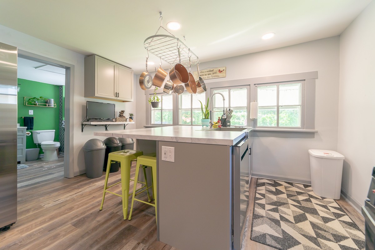 409 South 11th Street Clarksville, TN 37040 - Photo 6 of 29 a dining room with furniture a chandelier and wooden floor
