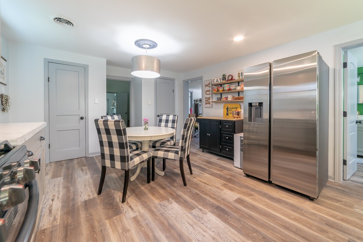 409 South 11th Street Clarksville, TN 37040 - Photo 7 of 29 a view of a dining room with furniture and wooden floor