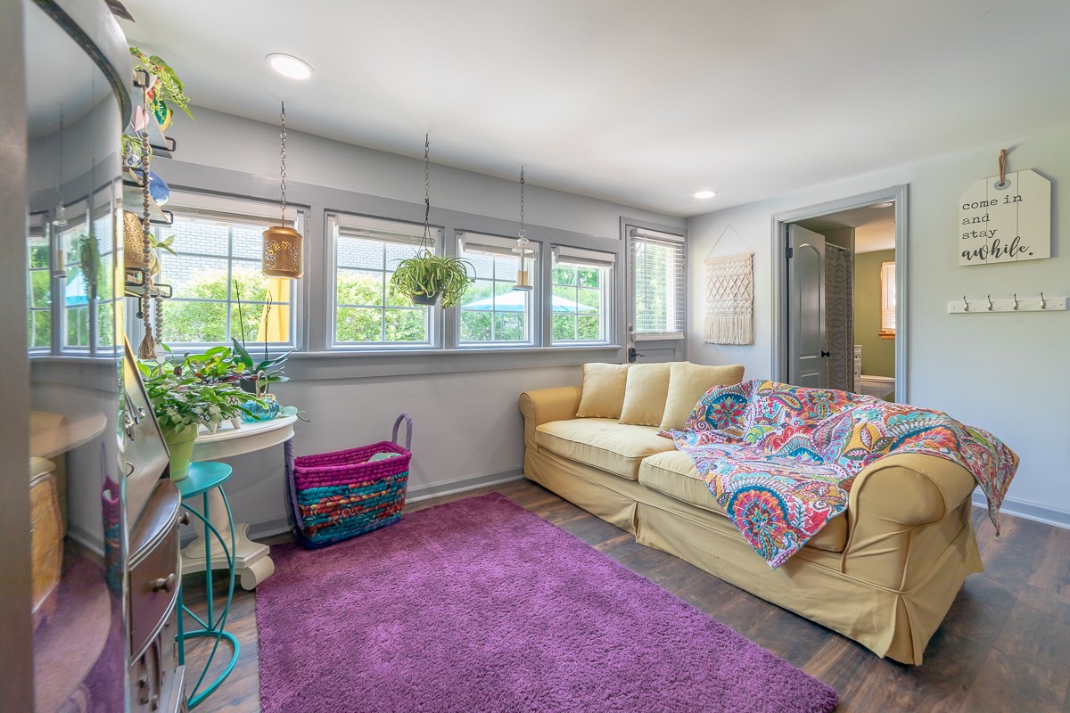 409 South 11th Street Clarksville, TN 37040 - Photo 10 of 29 a bedroom with a bed and a couch