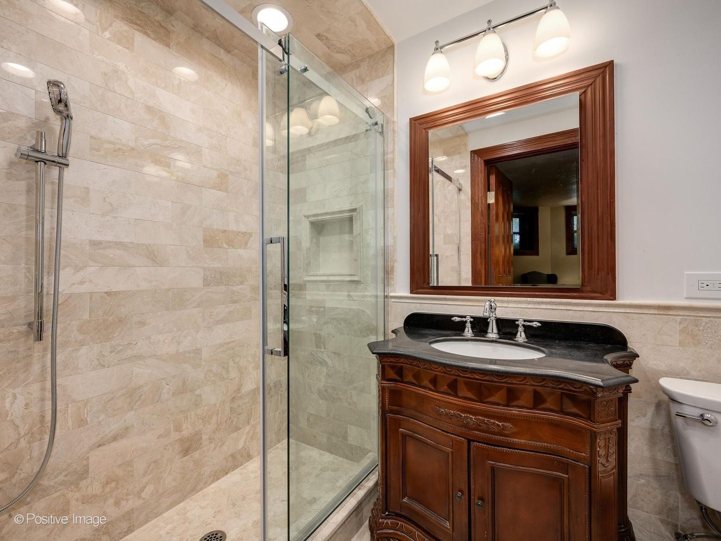 33 East Division Street Chicago, IL 60611 - Photo 32 of 34 a bathroom with a sink and a mirror