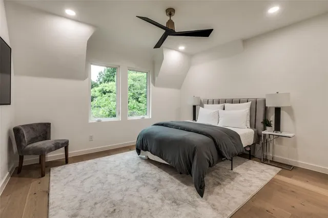 a bedroom with a bed and a chair