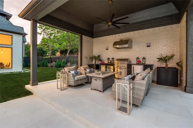 a living room with patio furniture and a floor to ceiling window