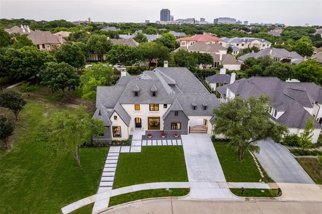 an aerial view of multiple houses with yard