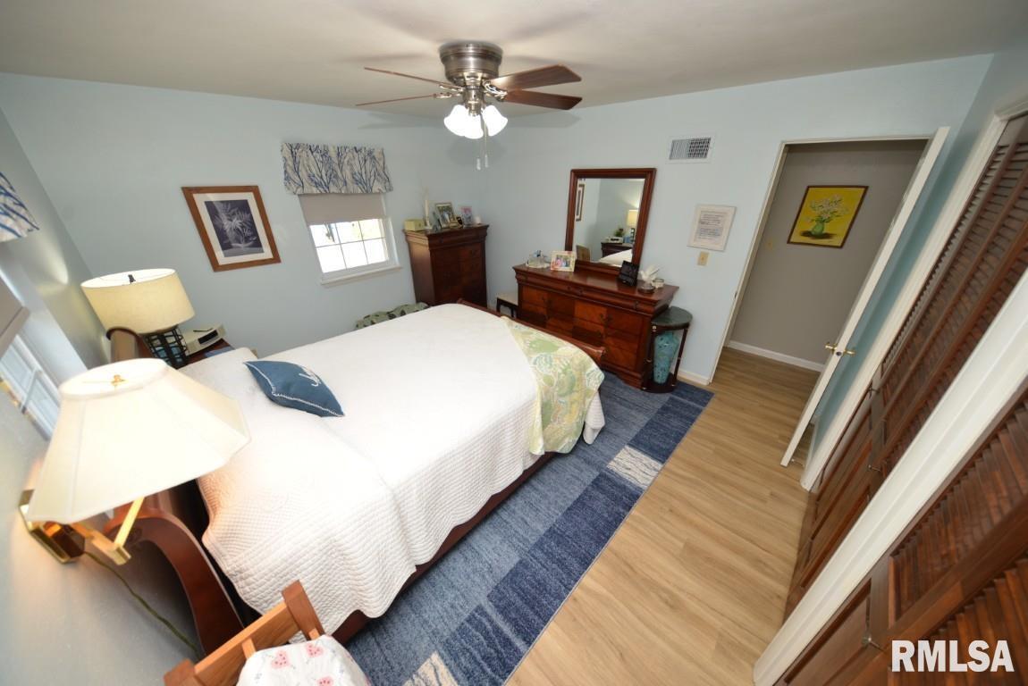 10 Edgewood Drive Mount Vernon, IL 62864 - Photo 29 of 41 a spacious bedroom with a bed and a chandelier