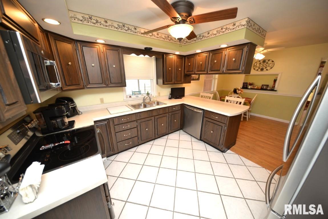 10 Edgewood Drive Mount Vernon, IL 62864 - Photo 30 of 41 a kitchen with a sink a stove and cabinets