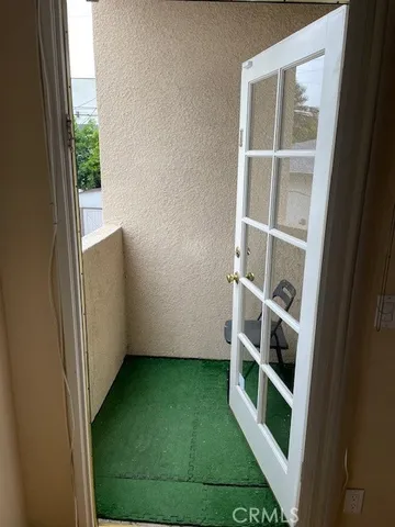 a view of front door with wooden floor