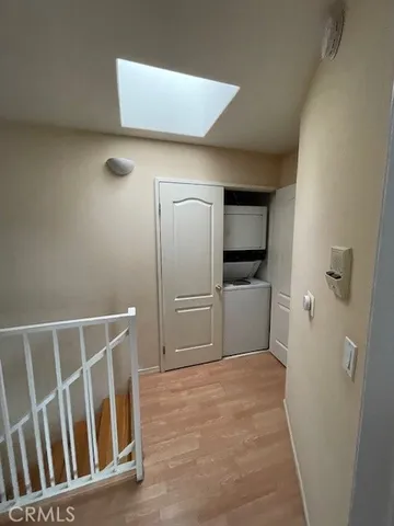 a view of a hallway with a bathroom