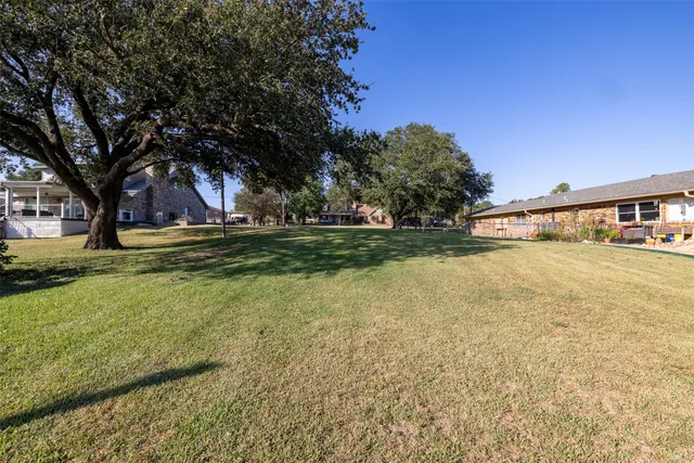 a view of a swimming pool with an outdoor space and seating area