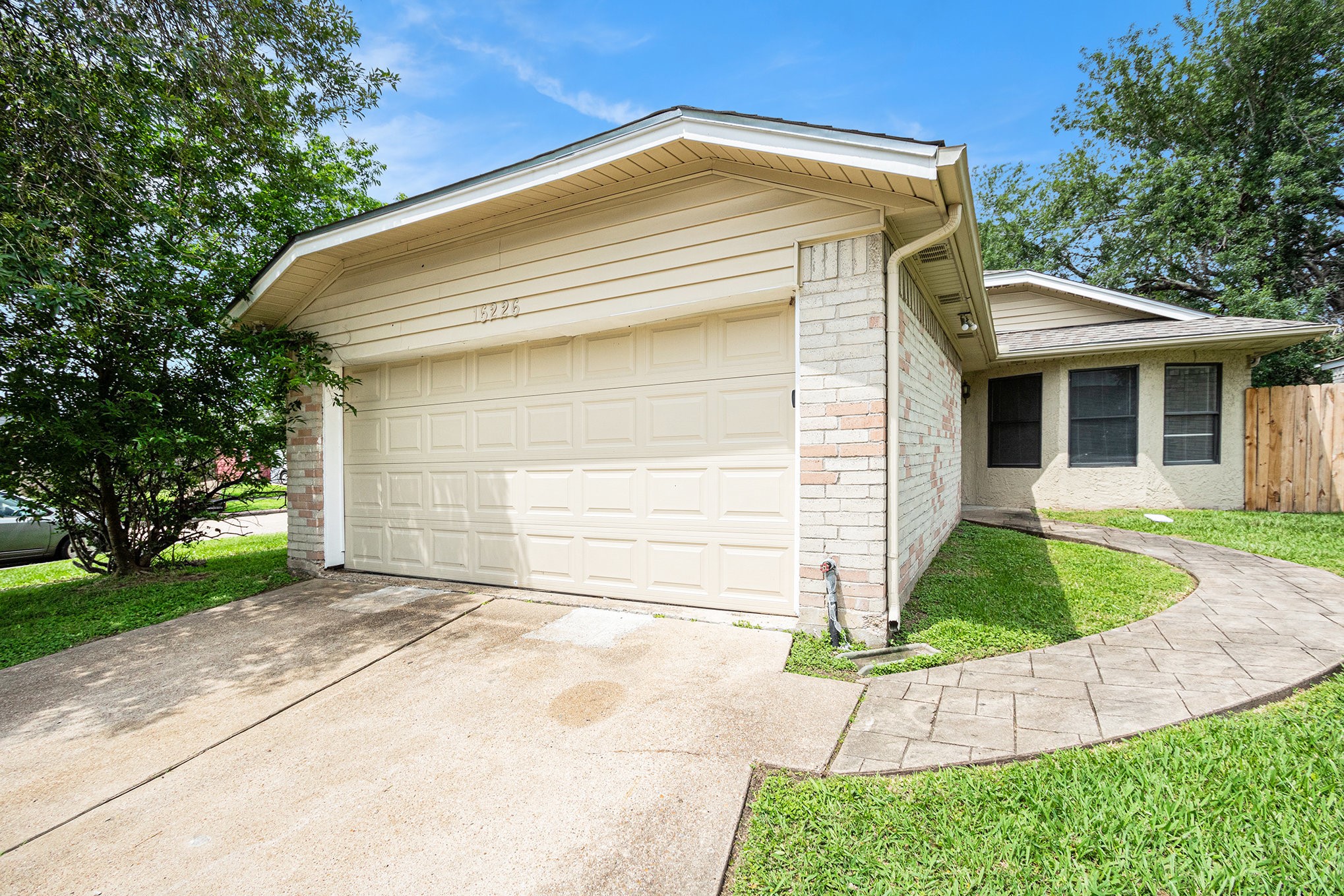 16226 Alden Ridge Drive Houston, TX 77053 - Photo 1 of 22 a front view of a house with a yard