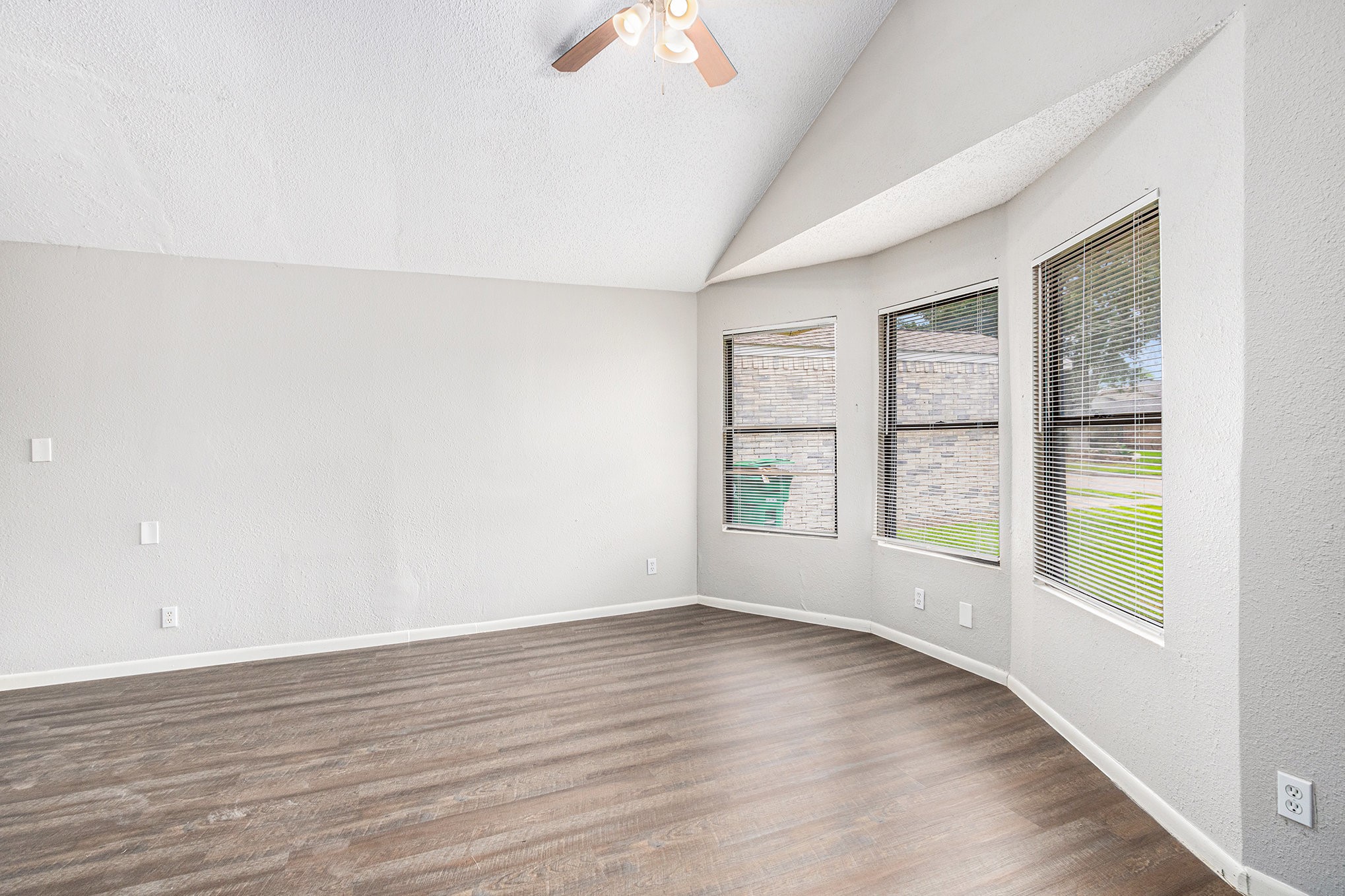 16226 Alden Ridge Drive Houston, TX 77053 - Photo 11 of 22 an empty room with wooden floor and windows