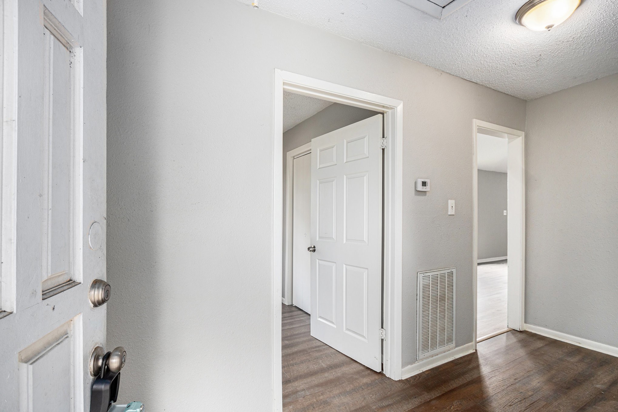 16226 Alden Ridge Drive Houston, TX 77053 - Photo 3 of 22 a view of a hallway with wooden floor