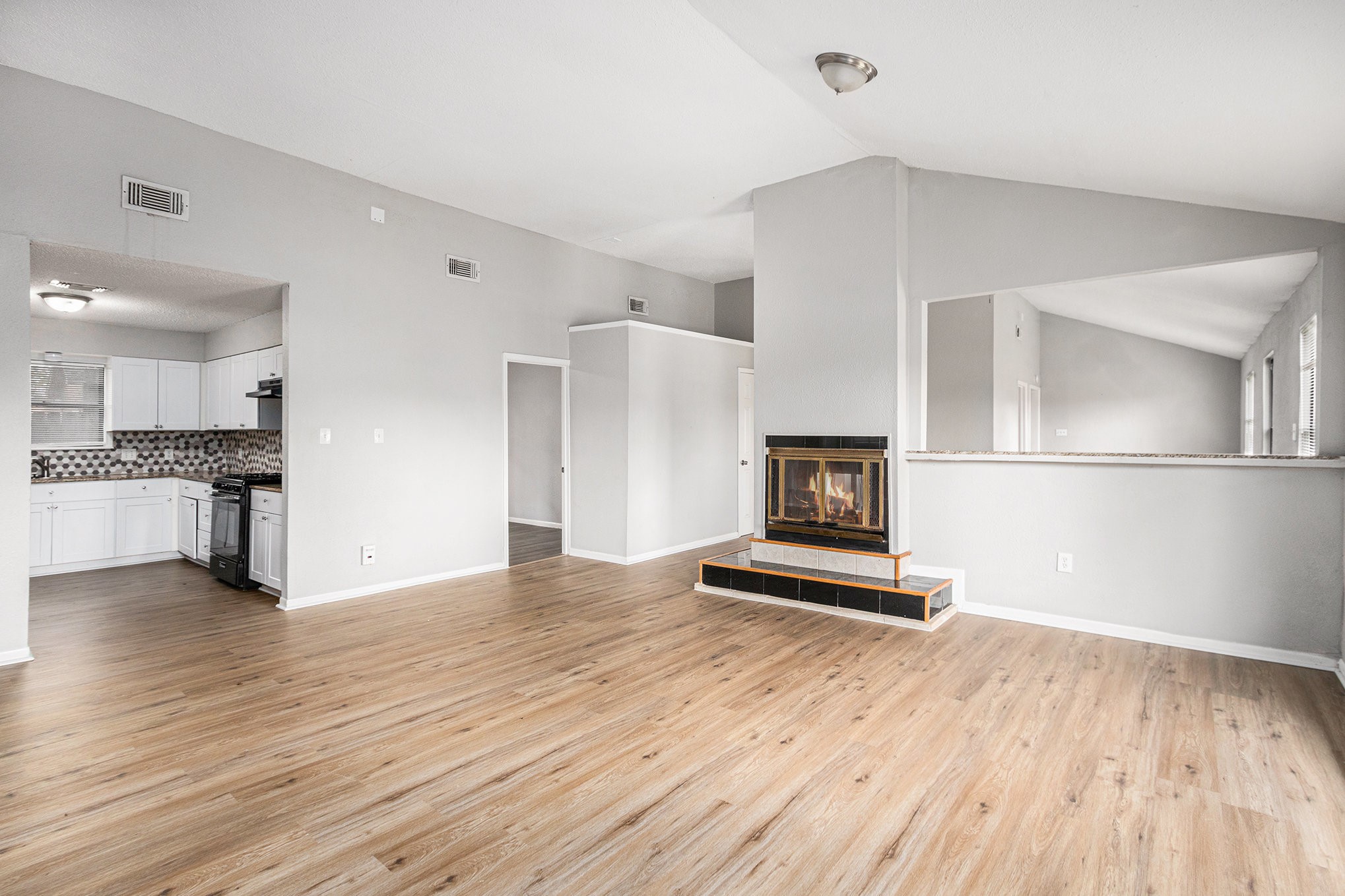 16226 Alden Ridge Drive Houston, TX 77053 - Photo 6 of 22 a view of a kitchen with wooden floor and a refrigerator