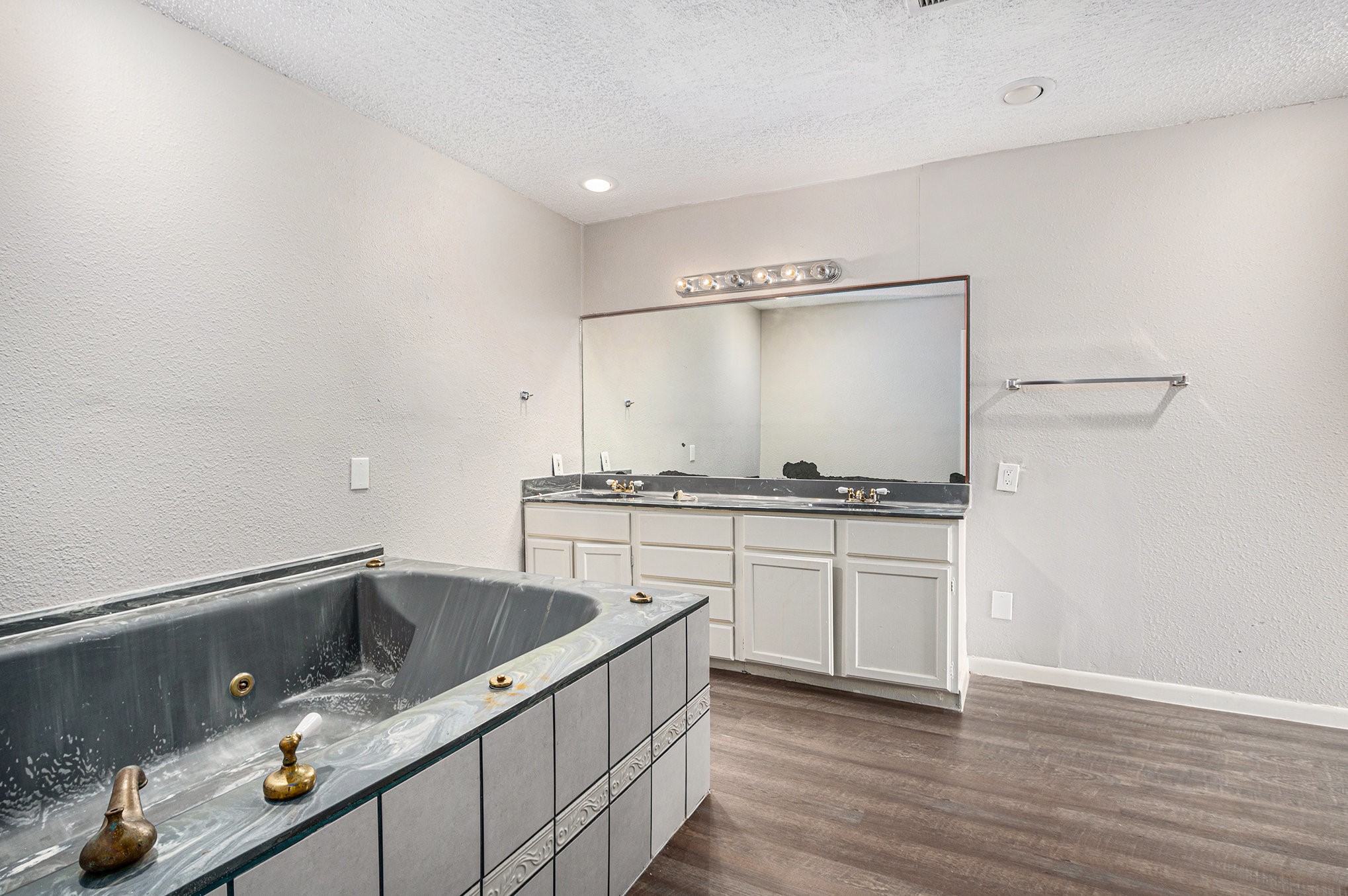 16226 Alden Ridge Drive Houston, TX 77053 - Photo 8 of 22 a kitchen with a sink cabinets and wooden floor
