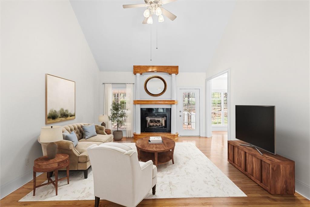 1030 Lakeview Parkway Villa Rica, GA 30180 - Photo 6 of 46 a living room with furniture a fireplace and a flat screen tv