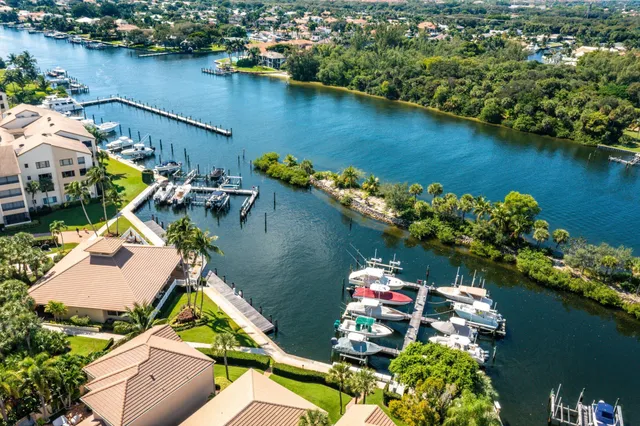 an aerial view of a house lake view and boat