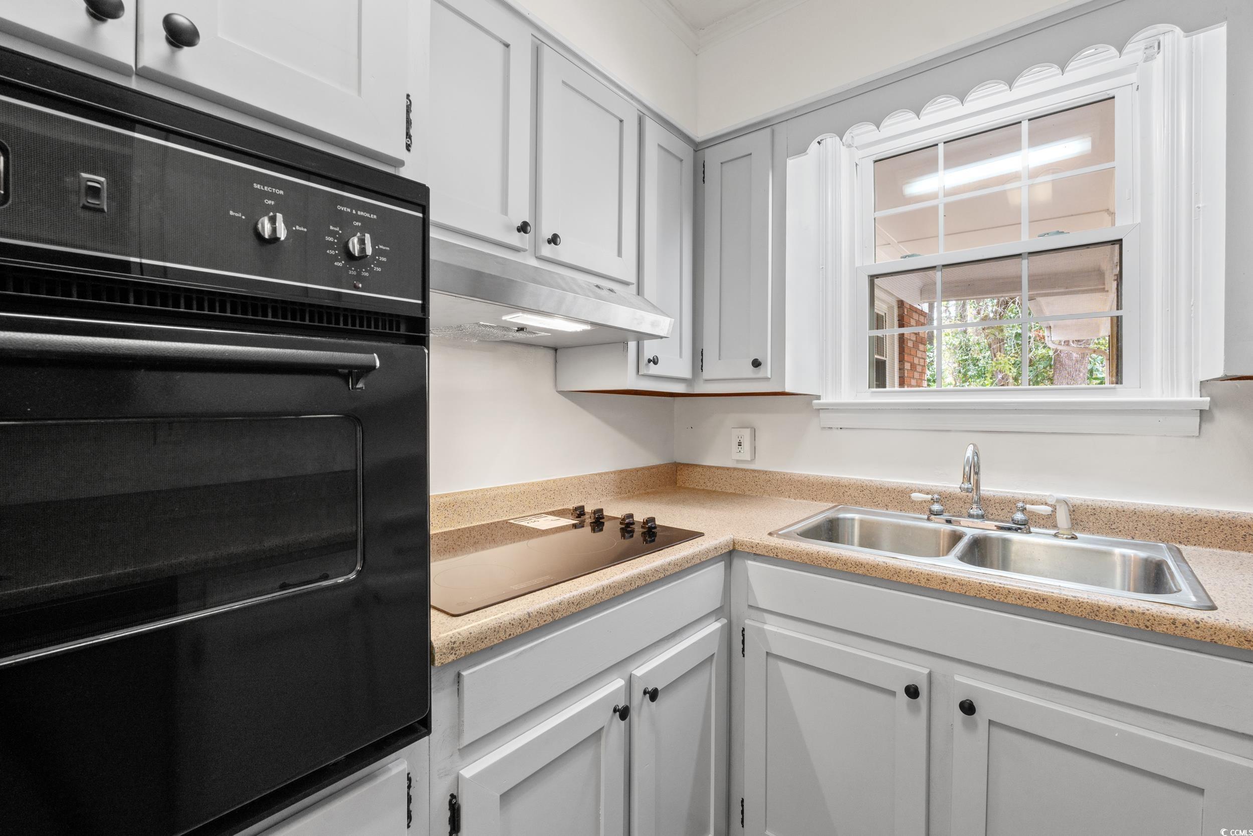 4162 Stevens Street Loris, SC 29569 - Photo 12 of 37 Kitchen with white cabinets, black appliances, und