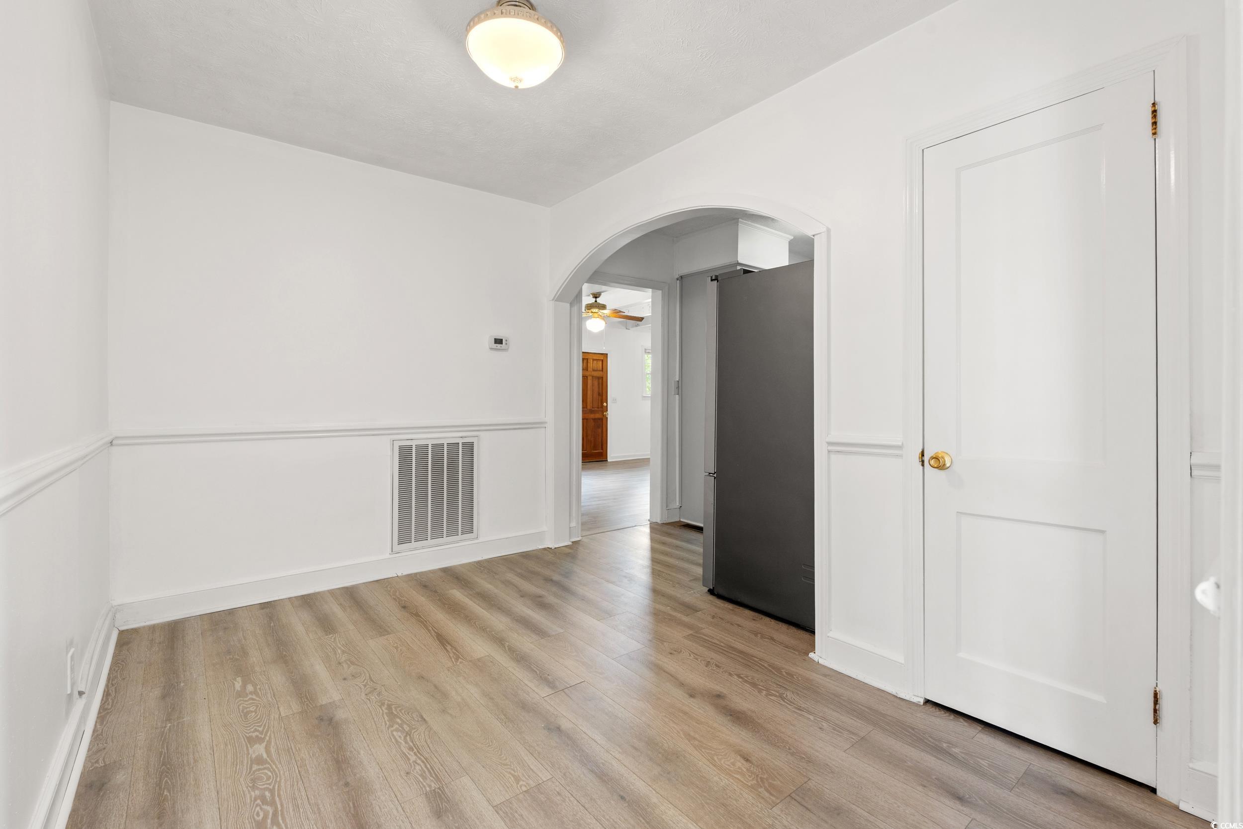 4162 Stevens Street Loris, SC 29569 - Photo 13 of 37 Unfurnished room with light wood-style floors, arc