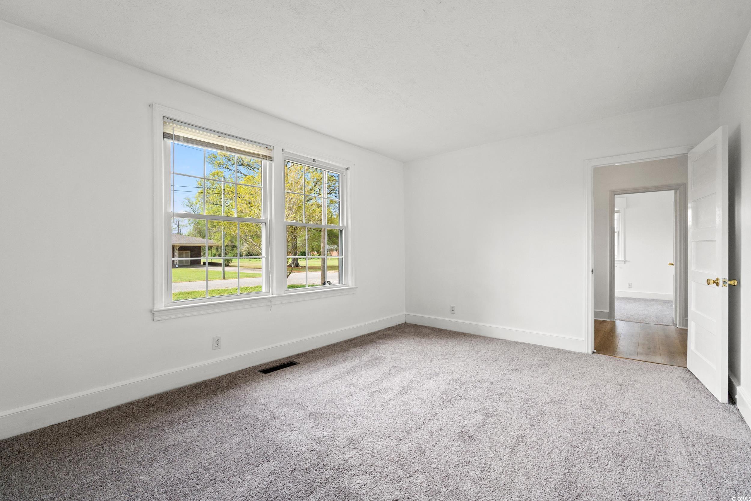 4162 Stevens Street Loris, SC 29569 - Photo 14 of 37 Empty room with carpet floors, baseboards, and vis