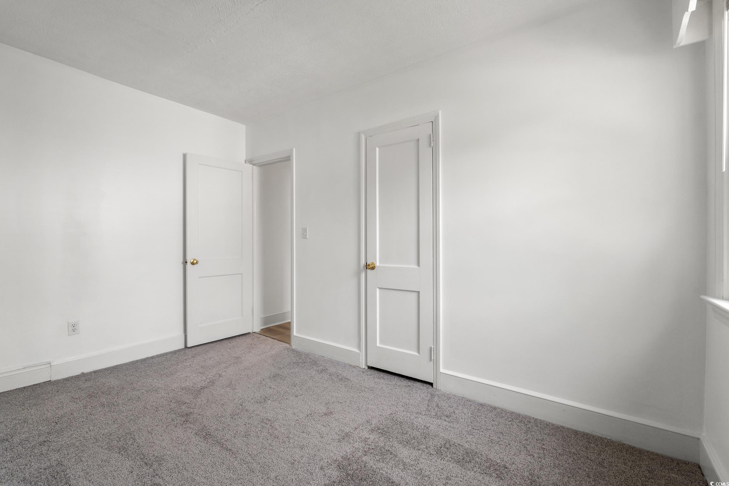 4162 Stevens Street Loris, SC 29569 - Photo 17 of 37 Empty room with carpet flooring and baseboards