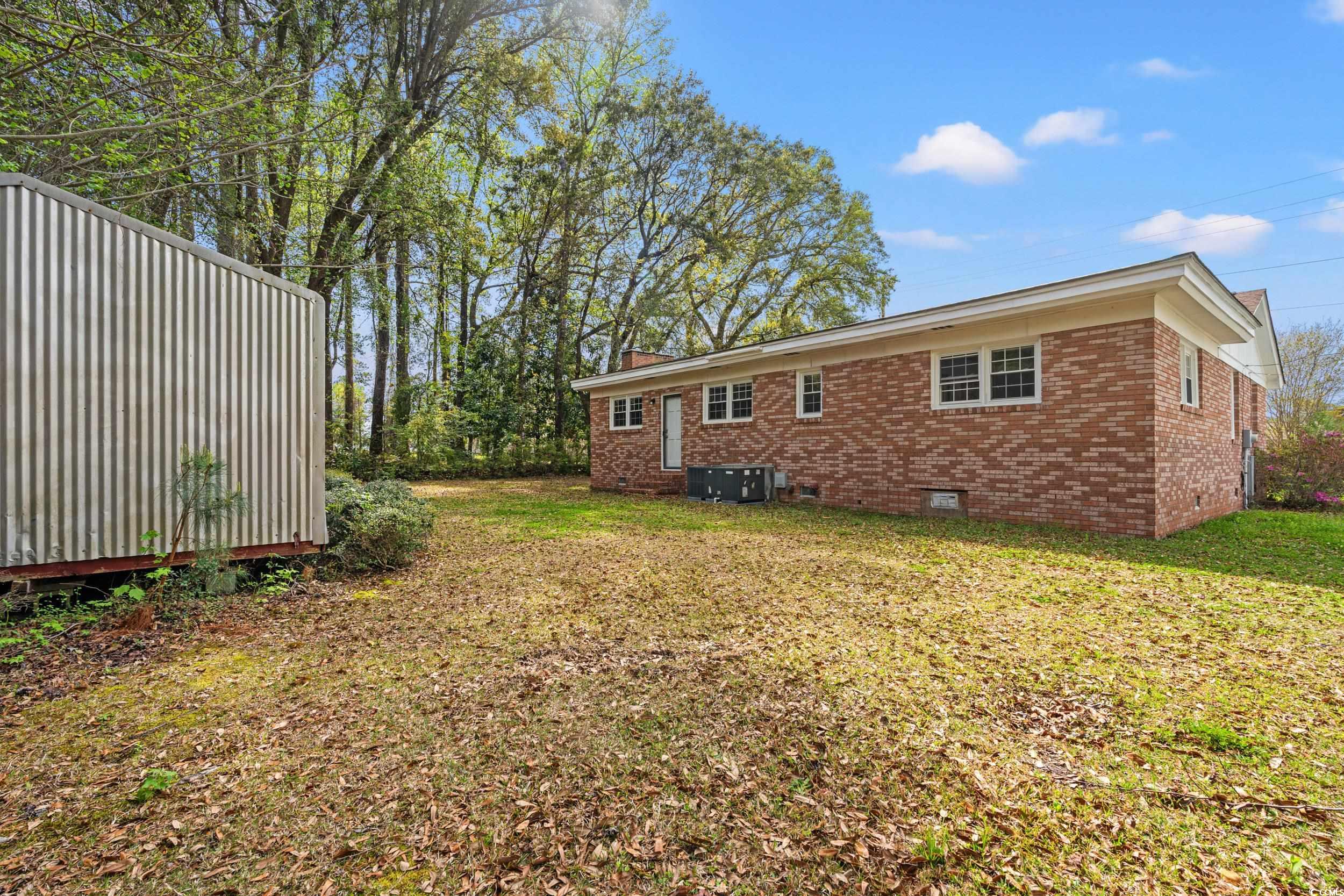 4162 Stevens Street Loris, SC 29569 - Photo 22 of 37 View of yard featuring central AC