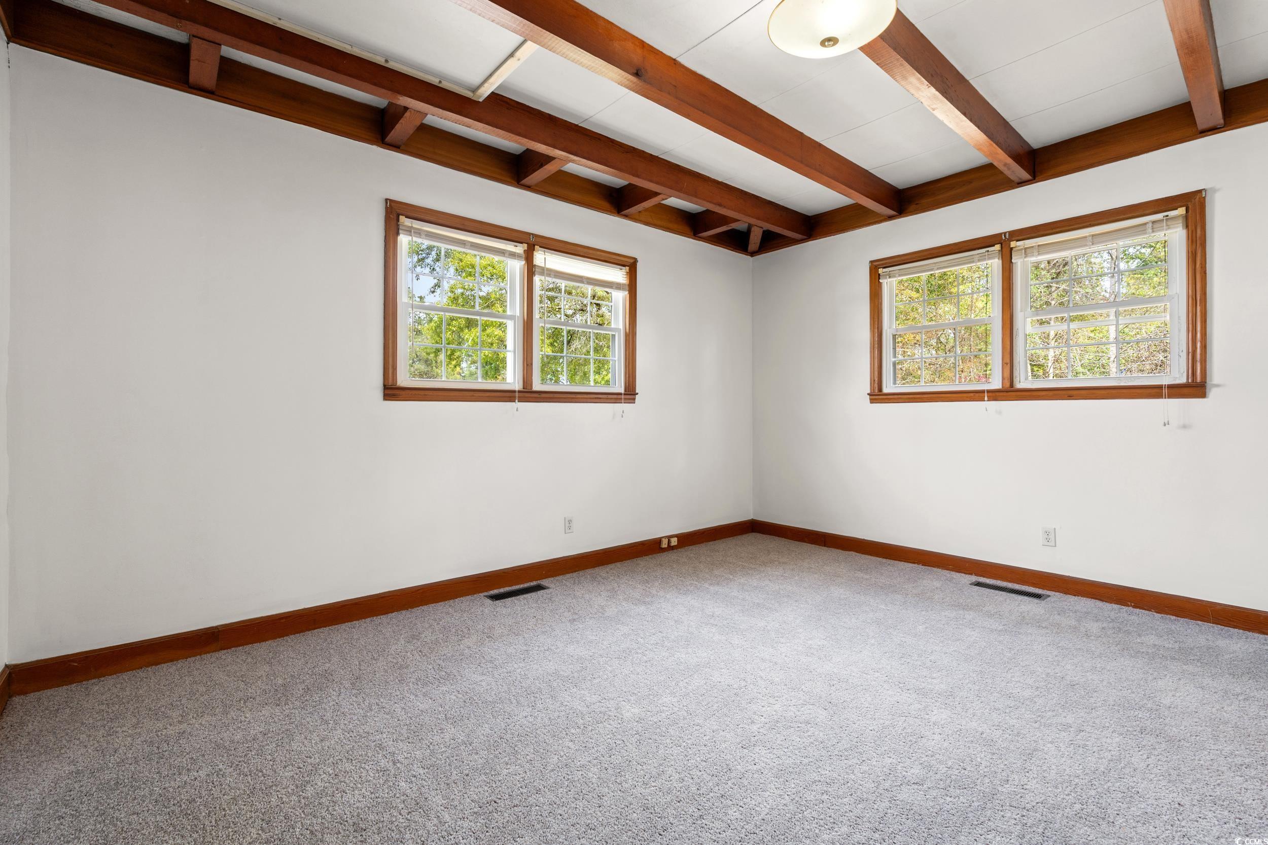 4162 Stevens Street Loris, SC 29569 - Photo 9 of 37 Carpeted empty room featuring visible vents, baseb