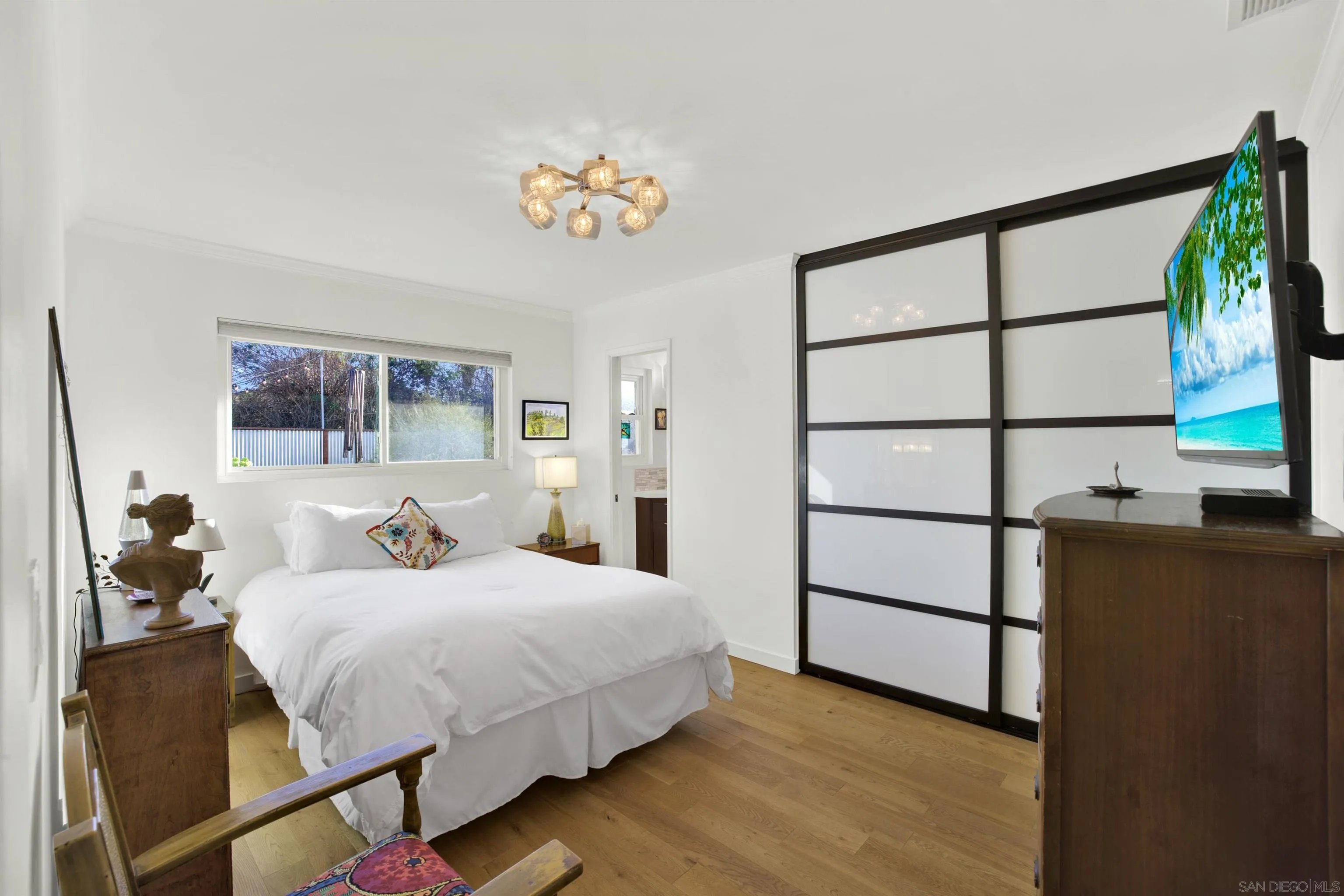 4005 Celeste Drive Oceanside, CA 92056 - Photo 12 of 18 a bedroom with a bed and a painting on the wall