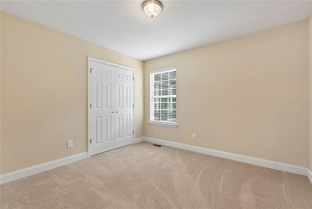 1044 Lothridge Road Cleveland, GA 30528 - Photo 32 of 40 a view of an empty room with a window