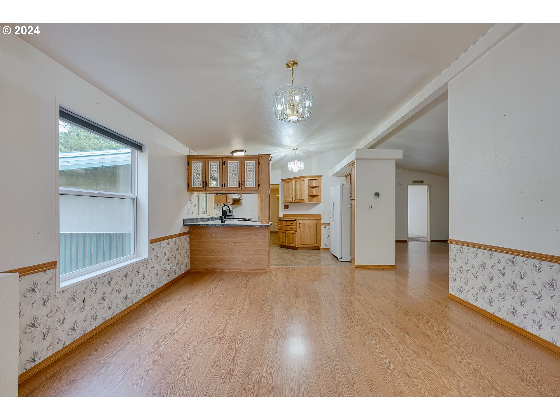 54473 Southwest Patton Valley Road Gaston, OR 97119 - Photo 6 of 42 a view interior of a house wooden floor and a kitchen